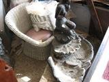 wicker settee + Concrete semi nude fountain