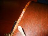 this guitar has several small (1/4in-1 1/2in) missing trim pcs. Does not affect sound