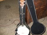 4 string Crestline strumming banjo in mint condition, Original hard case.