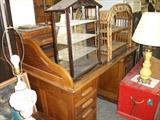 Oak "s"roll top desk, with 2 what not shelfs on it. red toy box, one of a pr. of lamps