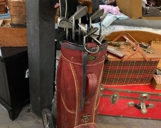 Several sets of golf clubs