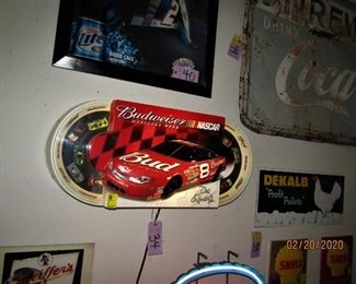 Budweiser Beer Dale Earnhardt Nascar oval track. Nascar theme motion - cars race around the track in the background, but Dale's car laps his competitors.