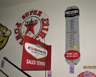 Cushman Motor flange sign, porcelain Prestone thermometer, Texaco super power Chief porcelain sign.