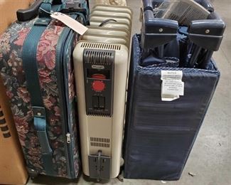 Floral Print Suitcase, Pack-and-Play and Space Heater
Floral Print Suitcase, Pack-and-Play and Space Heater