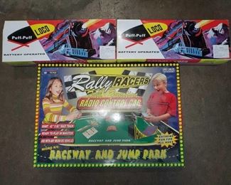 Raceway and Jump Park, 2 Battery Operated Toy Train
Raceway and Jump Park, 2 Battery Operated Toy Trains. All Toys are in original box, brands include Puff-Puff LOCO, and Rally Racers