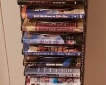 Lot of DVDs and Holder ~ All DVDs are in their Cases ~ Holder is 41 in. tall