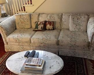 Contemporary sofa and marble top coffee table.