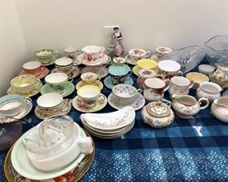 antique tea cups and assorted vintage crystal serving bowls.