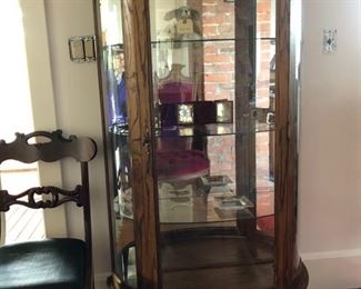 Display cabinet, if you take a closer look you will find tintypes, Versace trinket plate and other treasures.