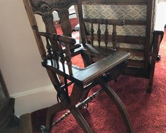 Antique highchair with adjustable height legs.