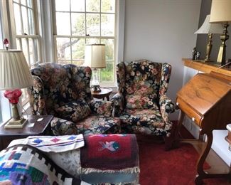 Two wingbacked chairs, antique dropfront desk, cranberry glass lamp.