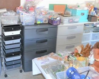 STORAGE DRAWERS UNDER LOTS OF CRAFT ITEMS AND CRAFT BOOKS,  RABBITS, TOYS. 
