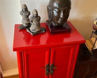Stone Buddha on rosewood base asking $380 . Carved Chinese warriors Red lacquer Kang style cabinet is 19.5"w x 12"d x 30"h asking $280