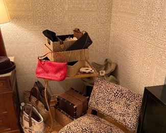 boudoir chair along with designer handbags