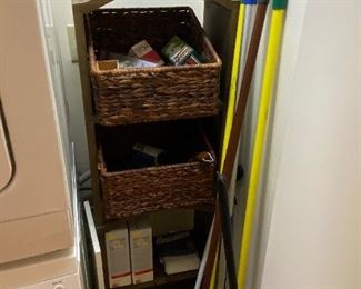 household cleaning tools and shelving unit