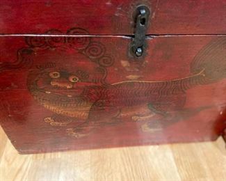 closer view of the face of the box painted with Foo Dog on the front