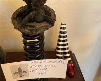 Metal sculpture of baby birds asking $40 Dorothy's ruby slippers $30