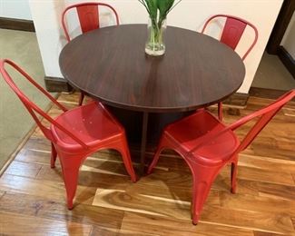 4 red metal chairs and wooden card table
