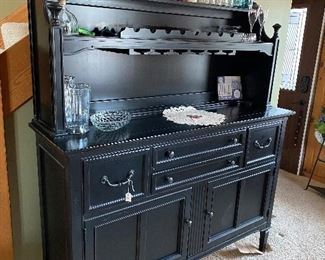 Beautiful sideboard with built in wine rack and wine glass holders.  Crystal, more antique jars.