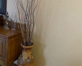 Large floor vase with twigs.