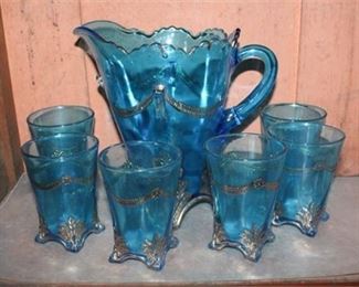 Lot 210
EAPG Blue Water Pitcher with Matching Tumblers Gold Accents