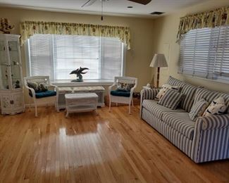 white wicker, sleep sofa, chairs and curio