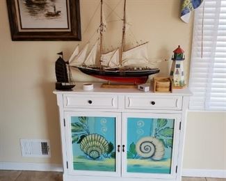 this has interchangeable pieces that go where the shells are, there are flowers to replace