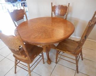 Round wood table w/4 chairs, 48" - some wear https://ctbids.com/#!/description/share/341228