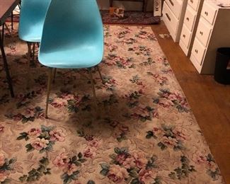 Vintage floral rug, turquoise plastic chairs (3 total), painted dresser & nightstands
