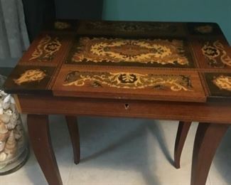Antique table with music box inside