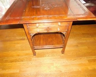 Beautiful mahogany drop leaf table hand carved top