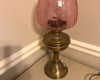 Unusual globe on brass oil lamp
