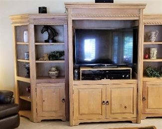 #103 - 3 piece entertainment storage bookshelf unit -  If you purchase all 3 pieces $325. Separately they are $135 each unit. Beautiful all wood. Great light color knotty pine like the master bedroom furniture. Has the same roping details. These are fabulous pieces at great bargains! Tons of storage and book shelf space!