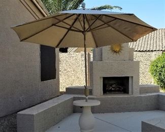 #122 Large beige umbrella - $65  cement table stand not for sale