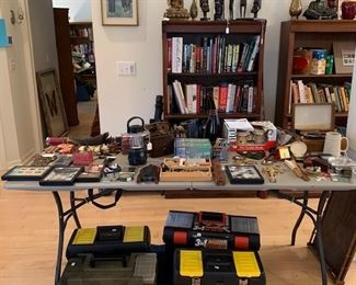 books, military items, bookcases and objects form world travels