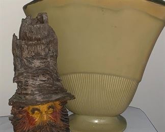 Red Wing Vase next to a fun carved figurine
