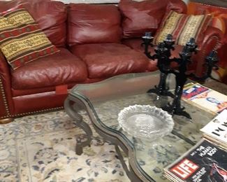 Vintage leather sofa and glass coffee table