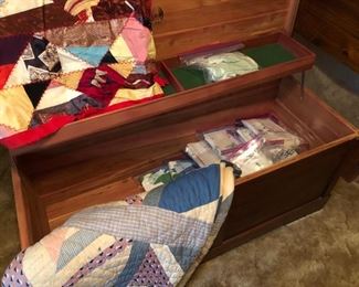 Embroidered pillow cases, vintage quilts on Lane cedar chest