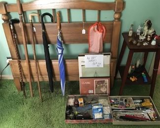 Twin head and foot board with side rails, canes, umbrellas, art supplies, small trikets