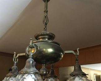 Old brass chandelier with glass bubble shades