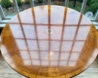 John Widdicomb round sunburst pedestal table with brass claw feet.  Measures 30" round and 28" H.