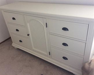 Super clean six drawer dresser. The center has shelves for pants, sweaters, etc. The drawers smell fresh and slide easily