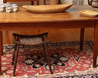 Old farm table with primitive handmade bread bowl.