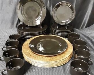Set of black dishes with gold chargers