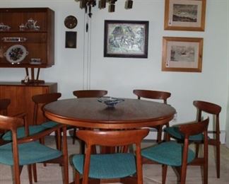 vintage teak 52" round dining table (w/2 leaves & pads) and set of 8 Harry Ostergaard dining chairs with original fabric