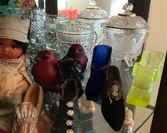 Many vintage statues and shelf sitters