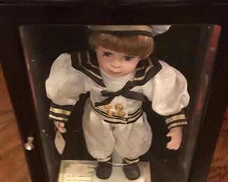 Sailor boy doll with certificate