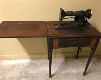 Antique singer sewing machine with cabinet