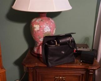 night stand, lamps, vintage camera
