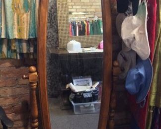 $65. 00  Floor standing oblong oval cheval mirror with wood frame and stand   62" x  26"  